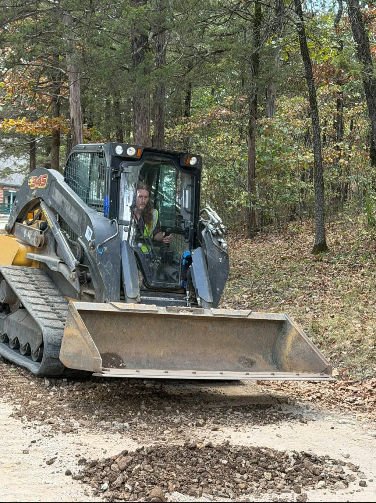 ACDC student operating a skid steer during hands-on training